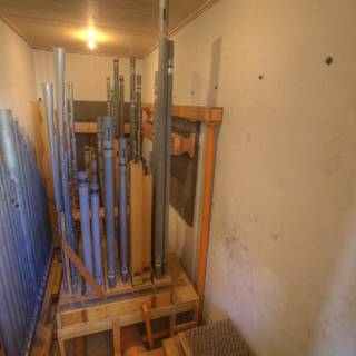 Pipes and Ladder in a Wooden Room