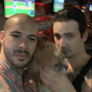 Two Men and a Canine in a City Bar