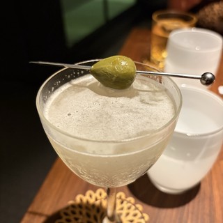 Elegant Martini with Olive Garnish at Upscale Bar