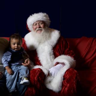 Santa Claus visits a family during their Christmas party