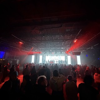 Electronic Music Concert with Red Stage Lighting