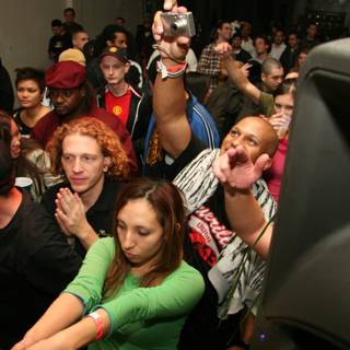 Partygoers groove to the beats of the DJ