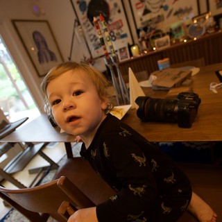 Toddler in Dinosaur Pajamas at Creative Home Office