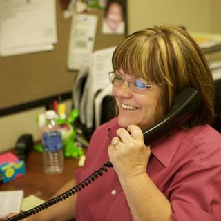 Pink-Clad Woman on a Serious Call
