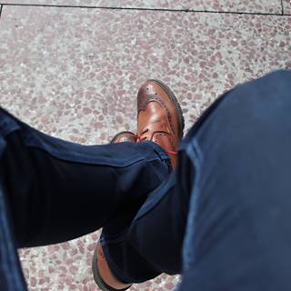 Man in Blue Jeans and Brown Shoes