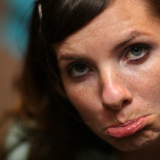 Pouty Blue-Eyed Woman With Freckles Close-Up