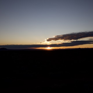 Dramatic Sunset Over Desert Mountains and Plains
