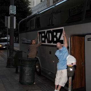 Putting Up a Sign on a Bus