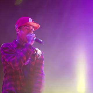 Tyga Rocks the Crowd in a Red Hat