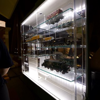Illuminated Display Case of Model Trains and Locomotives
