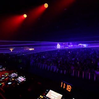 Massive EDM Crowd Bathed in Purple Laser Light