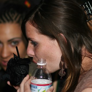 Two Women Socializing at a Nighttime Party Event