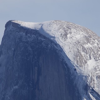 Half Dome's Snow-Covered Summit in Winter Light