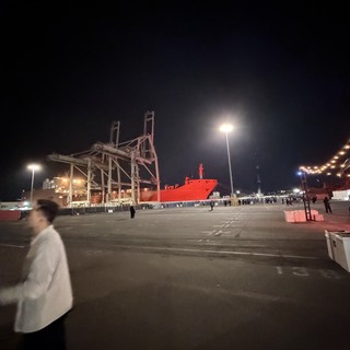 Industrial Port Night Scene with Red Cargo Ship