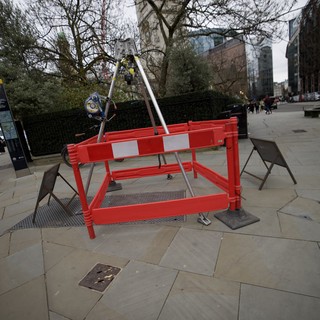 Construction Barrier on London Pavement with Tower