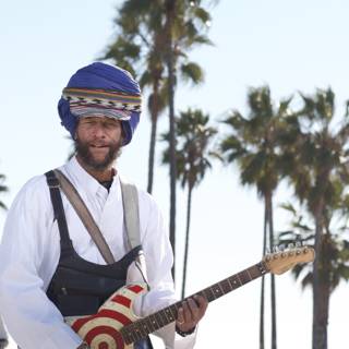 Turbaned Guitarist serenades under Palm Trees