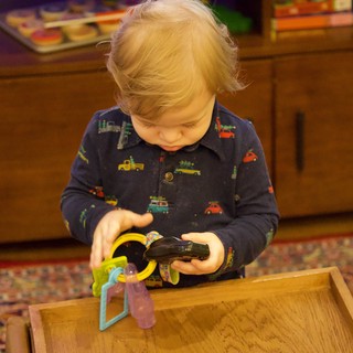 Toddler Playing with Toys on Christmas Eve