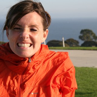 Windswept Woman Smiling by the California Coast