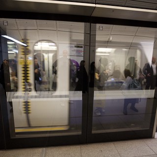 London Underground station platform, likely a modern or recently modernized line with platform screen doors
