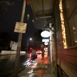 Rainy Night Street Scene with String Lights