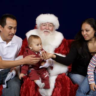 A Family's Festive Moment with Santa Claus