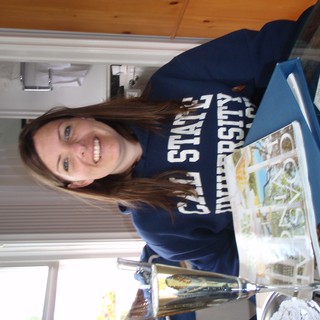College Student Smiling with Cal State University Sweatshirt