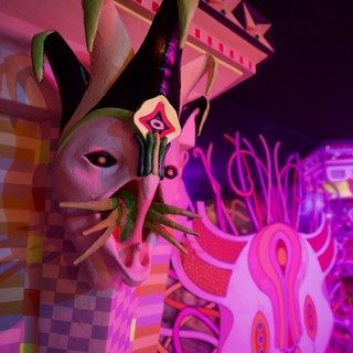 Surreal Pink Illuminated Sculpture in Dark Gallery