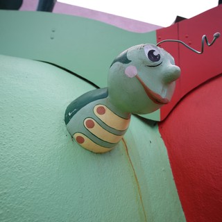 Whimsical Caterpillar Sculpture at Colorful Playground