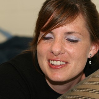 Candid Portrait of a Smiling Young Woman Indoors