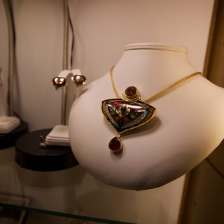 Artisan Jewelry Display with Boulder Opal Pendant Necklace