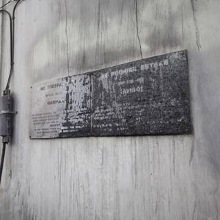 A Plaque on the Architectural Slate Wall with Wires