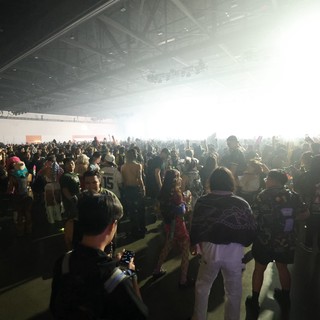 Massive Indoor Rave Crowd Erupts Under Blinding Stage Lights