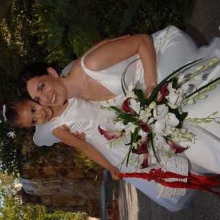Bride and Flower Girl Share a Tender Wedding Moment