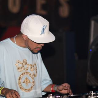 Blue Shirt, White Hat, and a DJ Set