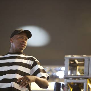YG Lights Up the Stage in Stripes and a Cap