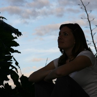 Contemplative Woman Gazing at Twilight Sky