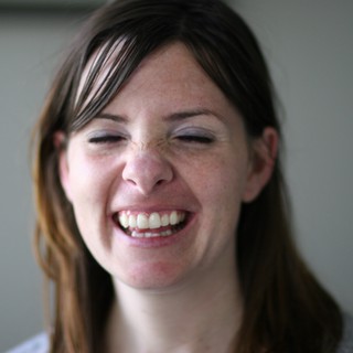 Joyful Woman Laughing with Eyes Closed