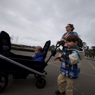 Family Outing with Stroller on Cloudy Day