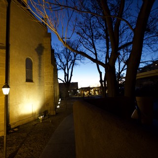 Church at Twilight with Bare Trees and Street Lamp