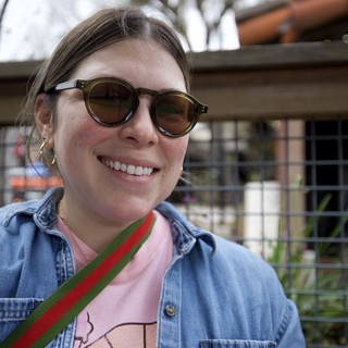 Smiling Portrait at Outdoor Venue in Sunglasses
