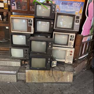 Vintage Television Collection on Seoul Sidewalk