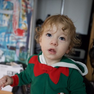 Toddler in Christmas Elf Costume at Home