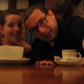 Couple Sharing Coffee at a Cozy Restaurant Table