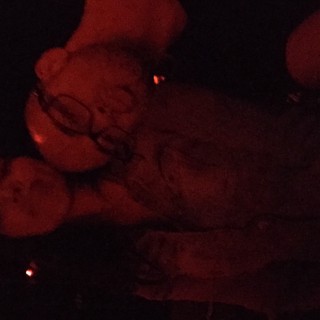 Two Friends Bathed in Red Light at Night