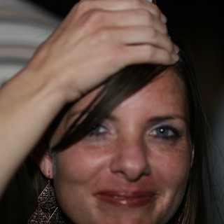 Candid Portrait of Smiling Woman at Evening Gathering
