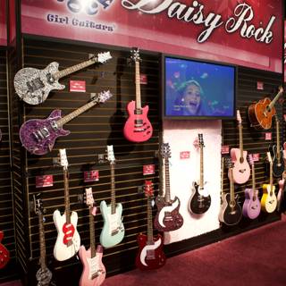 A Woman Admires the 22 Electric Guitars on Display