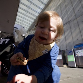 Toddler Enjoying a Snack at Transit Station