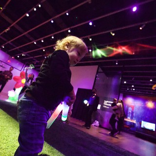 Child at Baby Rave Event with Glow Stick