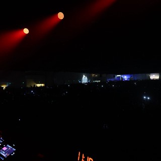 DJ Booth Perspective Over Massive Festival Crowd at Night