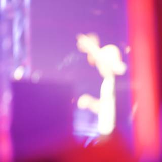 Blurry Solo Performance in Purple Spotlight